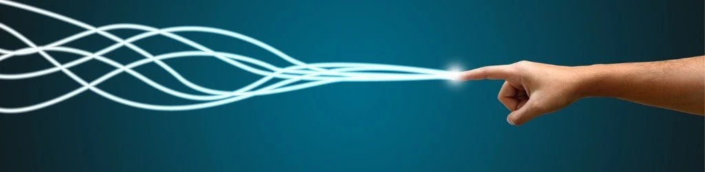 Hand reaching out to touch flowing light waves, symbolizing connection and innovation in market research for brand development.