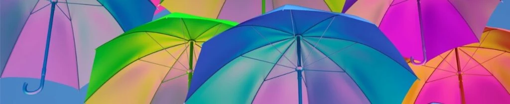 Colorful umbrellas in various shades of pink, green, and blue, illustrating the psychology of color in branding and marketing.