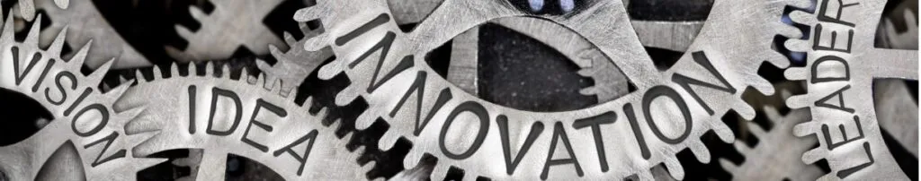 Gears with words "Vision," "Idea," "Innovation," and "Leadership," symbolizing concepts in new product development and market research.