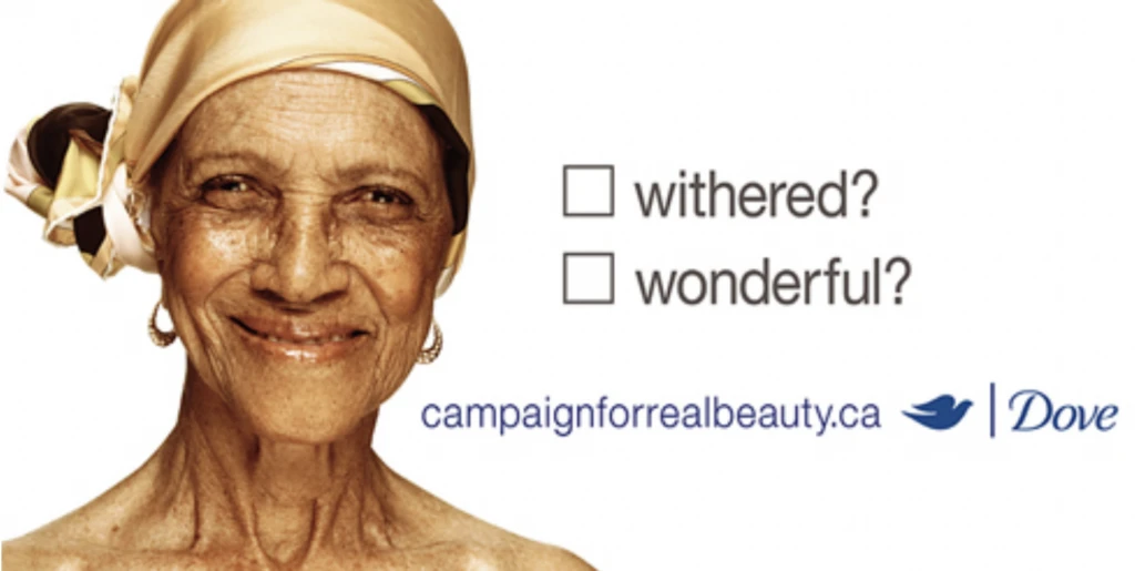 Elderly woman smiling with a headscarf, promoting Dove's Campaign for Real Beauty, featuring the text "withered?" and "wonderful?" emphasizing self-esteem and real beauty.