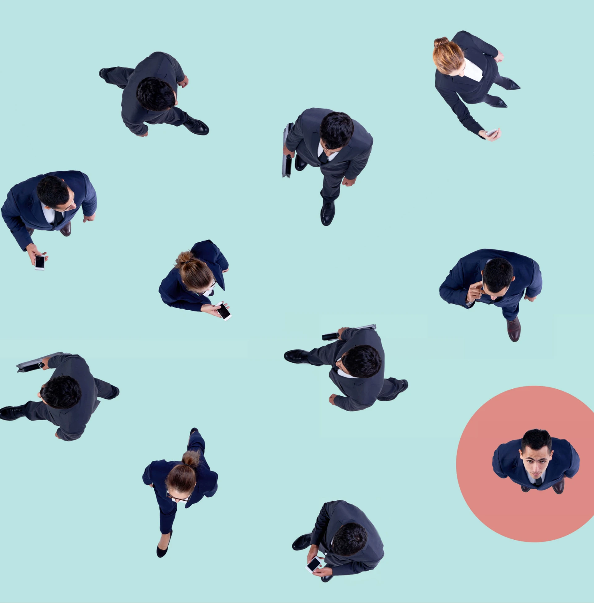 Group of business professionals in suits walking and using smartphones, representing B2B segmentation and market research dynamics.