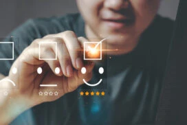 Person selecting a positive customer feedback option on a digital interface, symbolizing brand loyalty and customer satisfaction in market research.