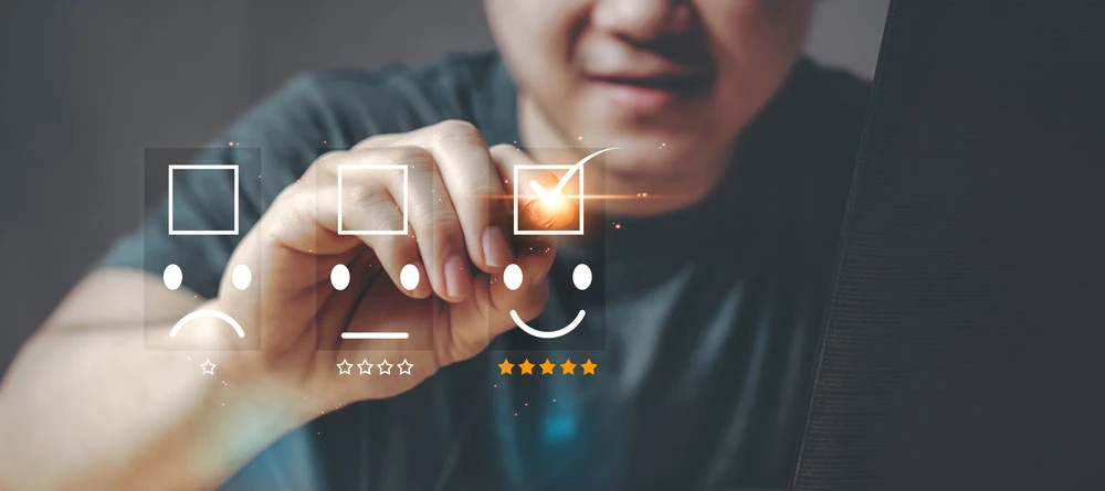 Person interacting with customer feedback icons, highlighting satisfaction in a digital context related to brand tracking and market research.
