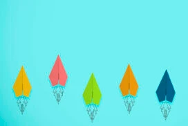 multicoloured paper rockets symbolising brand performance improving